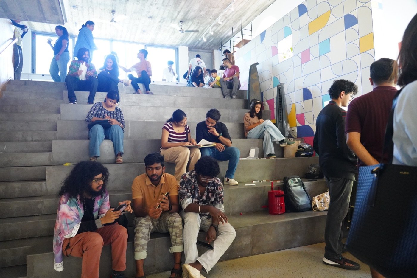 Visitors seated on the steps at the venue