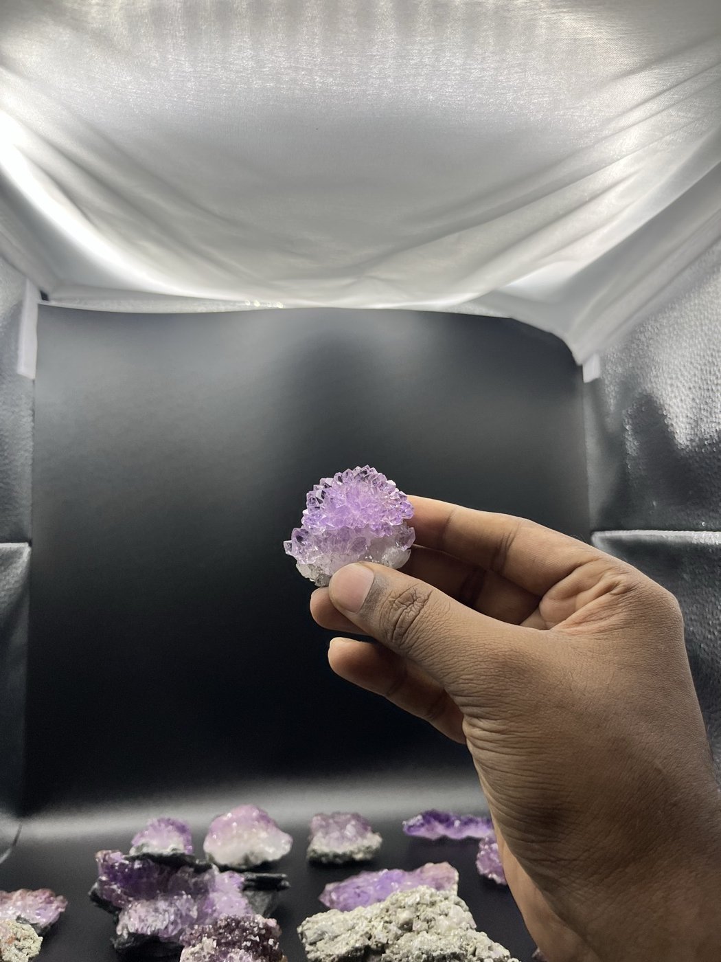 A Karur amethyst specimen held in hand