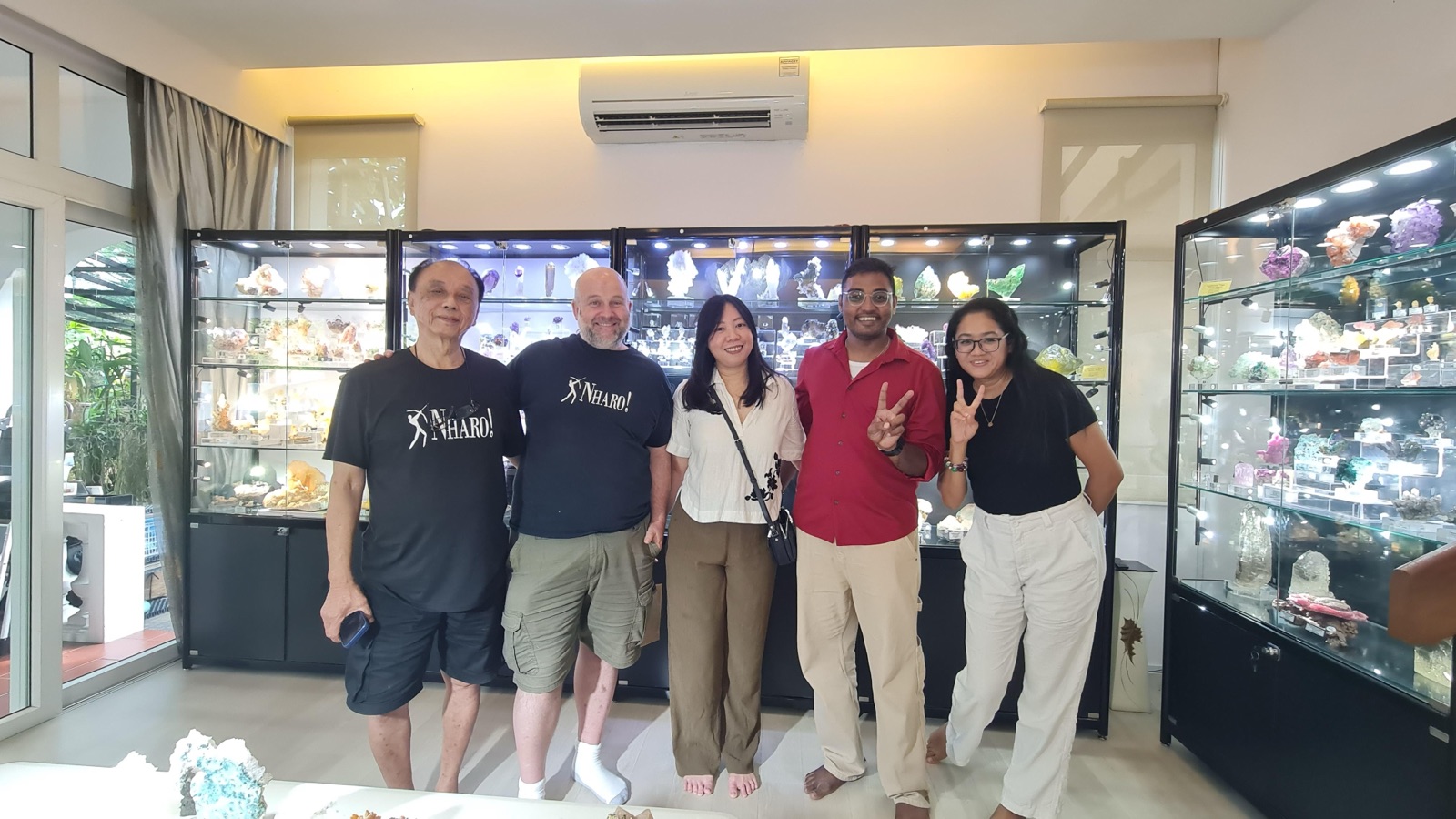 With mineral dealers in front of their display cases full of specimens